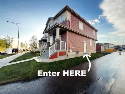 a house on a street with the words enter here at Elegant Escape with King Bed, Long Stays, WEM, Disney in Edmonton