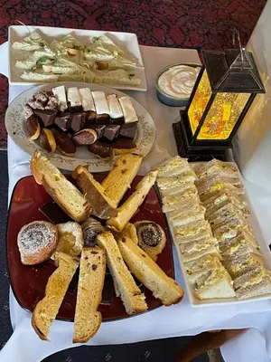 a table with two plates of food on a table at Gracies Grotto Cabin in Powell River