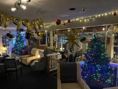 a room with a christmas tree and christmas decorations at Gracies Grotto Cabin in Powell River