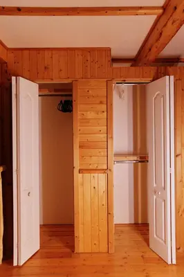 a room with a bunk bed and a refrigerator at Rustic Executive Cabin at Beaverfoot in Parson