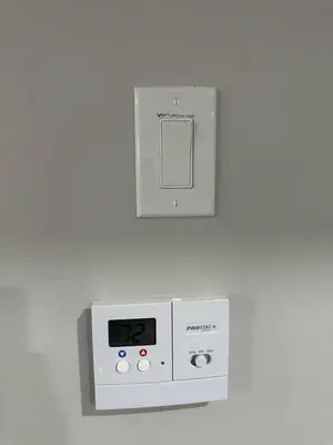 a clock on a wall with a clock on it at Luxurious Home in NW Calgary, Free Parking, High Speed Internet, Near Grocery and Airport in Calgary