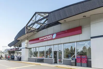 a store with a sign on the side of it at New Bright Modern Guest Suite in Vancouver in Burnaby