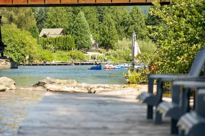 a view of a river with boats in the water at Riverside by Cowichan Lake Cottages in Lake Cowichan
