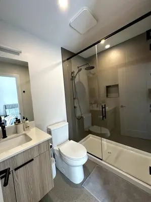 a bathroom with a toilet and a sink and a shower at Private Hot Tub Ski In Ski Out Sleeps 9 in Panorama