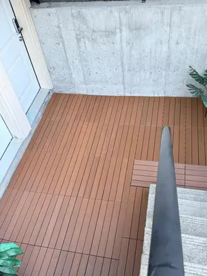 a porch with a wooden floor and a bench at Near Skytrain Metrotown Private Entry 3min walk to grocery food in Burnaby