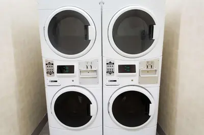 two washing machines stacked on top of each other at Hampton Inn by Hilton Lloydminster in Lloydminster