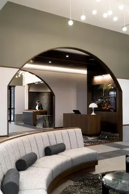 a living room with a couch in a lobby at Naturally Pacific Resort in Campbell River