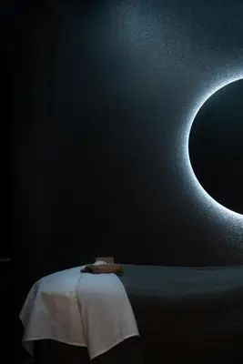 a room with a black wall with a moon at Naturally Pacific Resort in Campbell River