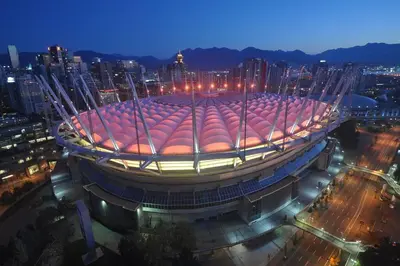 a large building with a soccer ball on top of it at Modern spacious Apt plus Solarium and Den in Downtown Vancouver with Parking and Pool in Vancouver