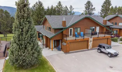 an aerial view of a house with a truck parked in front at Chateau Lawrence, Pool Table, Kids' Gaming Room in Fairmont Hot Springs