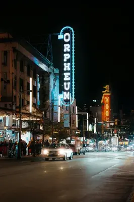 a car driving down a city street at night at The Altitude with Mountain & City Views, Pool & Hot Tub in Vancouver
