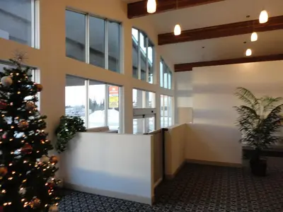 an office with a christmas tree in the lobby at South Hill Motor Inn in Red Deer