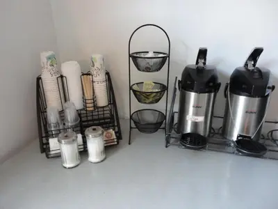 a shelf with coffee makers and other items at South Hill Motor Inn in Red Deer
