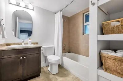 a bathroom with a sink and a toilet and a bath tub at Private 1 bedroom in Brookswood in Langley