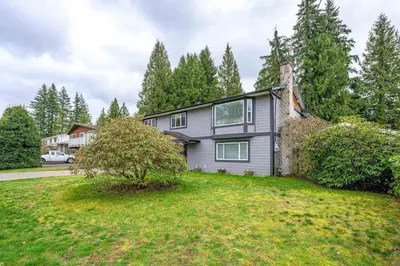 a large house with a yard at Private 1 bedroom in Brookswood in Langley
