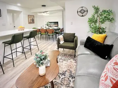a living room with a couch and a table at T201 Brand NEW Downtown Canmore 3BD & 2BT, BBQ, Free Parking in Canmore