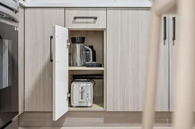 a kitchen with a cupboard with a blender in it at NEST- Modern 2BR Basement Retreat in South Surrey in Surrey