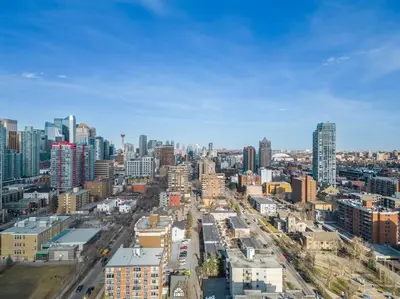 an aerial view of a city with tall buildings at Studio Just Steps from Stampede Park, Luxury Living in Calgary
