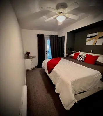 a bedroom with a bed and a ceiling fan at Modern Condo Dream at Fairmont in Fairmont Hot Springs