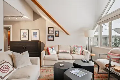 a living room with two couches and a table at The Nest, Central, Luxury Unit, Free Parking in Whistler