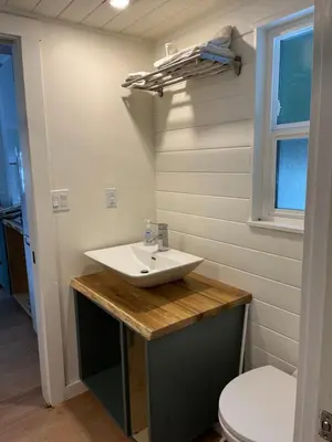 a bathroom with a sink and a toilet at Malaspina Strait Tiny Home in Powell River