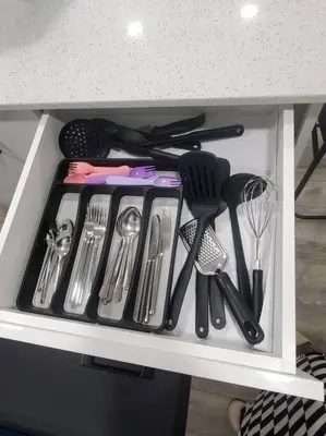 a drawer filled with utensils on a shelf at Charming 2-Bedroom Basement Oasis Sleeps 5,Size-150sqm, Netflix, family friendly in Edmonton