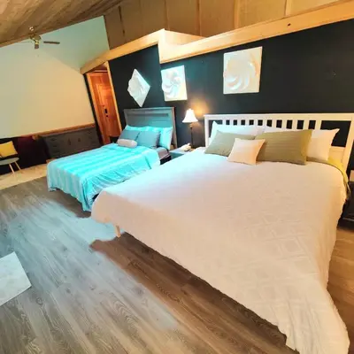 a bedroom with two beds in a room at Hummingbird B&B in Gabriola