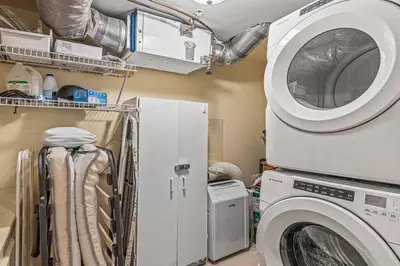 a laundry room with a washer and dryer at C303 Hidden Gem with MTN andCreek View, Quiet and Private in Canmore