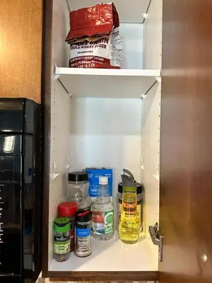 a pantry with medicines and other items in it at S105 Canmore Stay- Hot tub, stream rm, gym, parking Mtn Retreat in Canmore