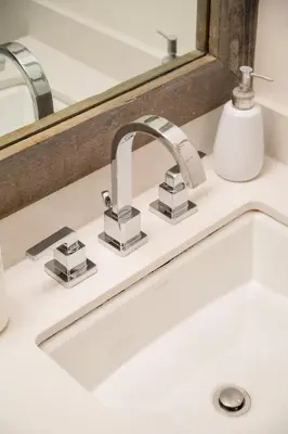 a sink in a bathroom with a mirror at Creekside Oasis 4 Beds Pool and Hot Tub in Whistler