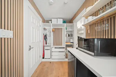a kitchen with a white counter and a microwave at Cozy Creek Den - Updated Nov 2025 in Whistler