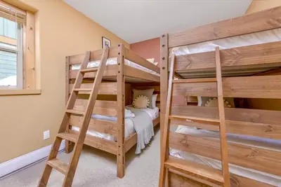 a bunk bed room with two bunk beds at Best Ski-in out 3 Bdrm Chalet, with Hot Tub in Big White