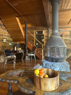 a room with a stove with a bowl of fruit at Rustic Beaverfoot Lodge Room N10 in Parson