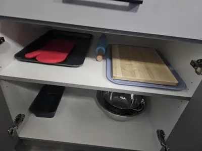 a kitchen counter with a cutting board and utensils at Sleek Home in Trendy Community at SW, Edmonton in Edmonton