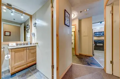 a large bathroom with a sink and a toilet at Greystone Lodge 332 Ski-in Out in Whistler