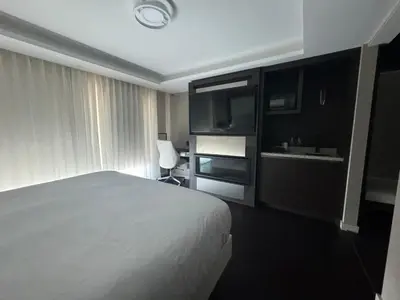 a hotel room with a bed and a sink at the reid hotel in Vanderhoof
