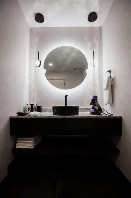 a bathroom with a sink and a mirror at the reid hotel in Vanderhoof