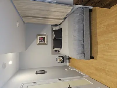 a small room with a bed in the ceiling at River Valley Suite Near Downtown in Edmonton