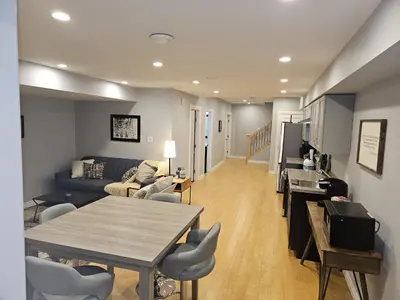 a living room with a couch and a table at River Valley Suite Near Downtown in Edmonton
