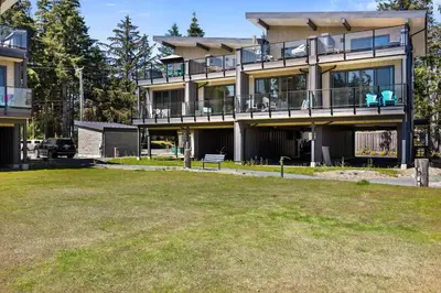 a large building with a lawn in front of it at The Beach House at Saratoga #2 in Oyster Bay