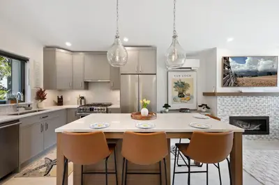 a kitchen with a table and chairs in it at The Beach House at Saratoga #2 in Oyster Bay