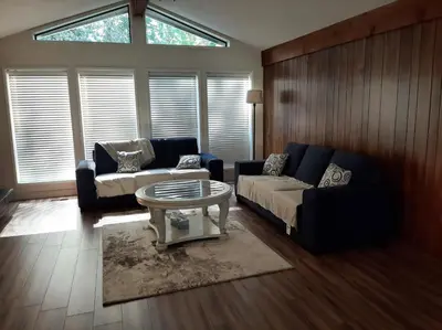 a living room with a couch and a table at Farmestate in Vancouver