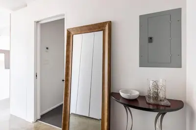 a mirror sitting on a table in a room at Cozy 1BR with AC, Chinatown, Rogers Arena, Seawall in Vancouver