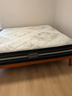 a mattress on a bed frame in a room at 2 Beds Guest Suite to Yourself at Coquitlam Centre Mall in Port Coquitlam