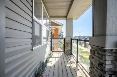 an empty porch of a house with a window at Large House Near Calgary Airport with Central AC, Double Car Garage Parking, Upgrade Stay, Netflix, Sleeps 8 in Calgary