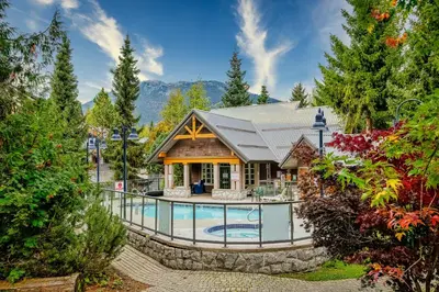a house with a swimming pool in the yard at Whistler Village, Private Hot Tub, Free Parking in Whistler