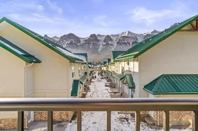 a view of the mountains from the balcony of a hotel at B233 Mountain View 2BD 2BT AC BonFire BBQ Townhome Close to Banff in Canmore
