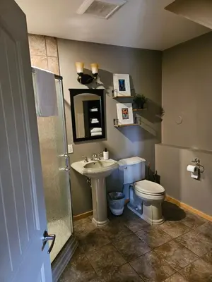 a bathroom with a toilet and a sink at Carriage House - 2 suites- HIKE & REST - EV plug in Golden