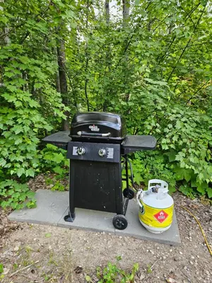 a black grill with a pot and a tea kettle at Carriage House - 2 suites- HIKE & REST - EV plug in Golden