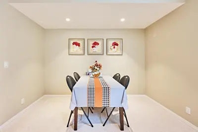 a dining room with a table and chairs at sweet home in Calgary